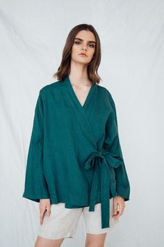 Linen wrap shirt AJO Oversize linen shirt  featuring wide arms  No pockets  open front with  tie- belt at waist. Shirt  length 25'' / 65 cm , ( from the back to the bottom of the jacket ) Model is 175 cm 5'9'' tall , 60 kg / 132 lbs and wear size L , color forest green DESCRIPTION: All our linen is pre-washed for an amazingly soft feel. Every time you wear the linen becomes softer and more beautiful.  All our linen  comes in a linen storage bag.  -Made from Oeko-Tex certified 100%  pure French l Belted Long Sleeve Summer Kimono, Summer Long Sleeve Belted Kimono, Casual Wrap Kimono With Tie Waist, Spring Long-sleeve Belted Kimono, Belted Long Sleeve Kimono For Spring, Spring Long Sleeve Belted Kimono, Long Sleeve Belted Linen Outerwear, Belted Long Sleeve Linen Outerwear, Belted Linen Long Sleeve Outerwear