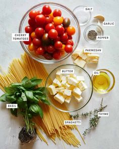 the ingredients to make pasta including tomatoes, cheese and basil