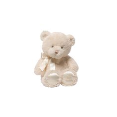 a white teddy bear with a bow on it's neck sitting against a white background