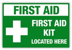 a green and white sign that says, first aid kit located here with the cross