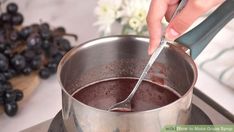 a person is stirring chocolate in a pot