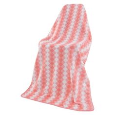 an orange and white checkered blanket on a white background