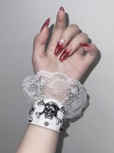 This bracelet features skeleton and stud decorations with lace trim design, available in pure white, pure black, and black and white.   The price is for a bracelet only, others are not included. Vkei Jewellery, Gothic White Jewelry For Festivals, White Gothic Jewelry For Festivals, Gothic White Festival Jewelry, White Gothic Festival Jewelry, White Punk Jewelry For Festival, White Punk Festival Jewelry, Edgy White Jewelry For Gifts, White Gothic Skull Jewelry