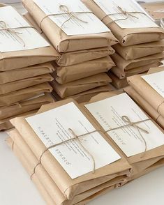 there are many packages wrapped in brown paper and tied with twine on the table