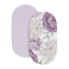 two oval trays with flowers on them, one in purple and the other in white