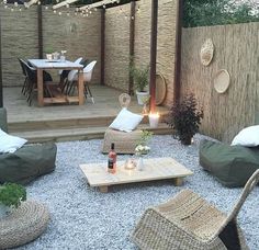 an outdoor living area with furniture and lights