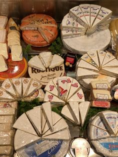 many different types of cheese are on display