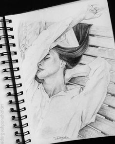 a pencil drawing of a woman sleeping on a bench