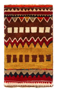 an old rug with different colors and patterns on it's sides, including red, brown