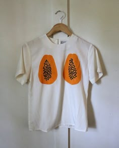 Fitted Graphic Tee With Print, Fitted Printed Graphic Tee Shirt, Fitted Printed Graphic Tee, Casual Orange Blouse With Graphic Print, Orange Printed Short Sleeve Tops, Fitted Graphic Tee Shirt, Fitted Top With Funny Print For Summer, Fitted Summer Tops With Funny Print, White Cotton Blouse With Graphic Print