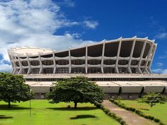 a large building that is next to some trees