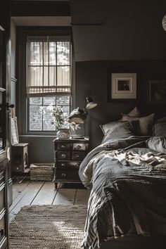 a bedroom with a bed, dresser and window