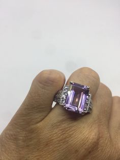 Unusual genuine Amethyst ring set with white sapphire on the sides. Very unusual. Sterling Filigree Setting Handmade size 7.5 can be re sized for you. Sterling Silver is rhodium finished to prevent tarnish All rings are shipped in a nice gift box. Check out our over a THOUSAND great reviews Engraving is $4 per letter and is not always perfect depending on the piece. It can take a few days if the jeweler is busy. This is payable to Paypal Judithsltd@gmail.com Multi Stone Ring, White Sapphire, Amethyst Ring, Purple Amethyst, Stone Rings, Ring Set, Ring Sets, Vintage Items, Jewelry Rings