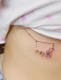 a woman's stomach with flowers on it and a line drawn across the side