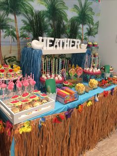 a table topped with lots of desserts and candy