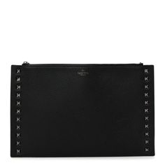 This is an authentic VALENTINO GARAVANI Pebbled Calfskin Large Rockstud Flat Zip Pouch in Black. This versatile and chic evening clutch is beautifully crafted of rich calfskin leather in black. It features gold pyramid studs on the borders as well as on the zipper pull. This opens to a spacious black suede interior with patch and zipper pockets. Black Studded Evening Bag, Luxury Black Bags With Studs, Rockstud Flats, Valentino Studs Bag, Valentino One Stud Bag, Luxury Black Leather-lined Clutch, Evening Clutch, Zip Pouch, Black Suede