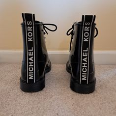 Muchael Kors Black Rain Boot. Thick Black Rubber Soles With Shiny Boot. Brand New Condition. Size 9. Trendy Black Waterproof Boots, Casual Black Waterproof Lace-up Boots, Black Round Toe Rain Boots For Spring, Michael Kors Casual Boots For Fall, Michael Kors Black Boots For Fall, Michael Kors Casual Leather Boots, Black Ankle-high Moto Boots With Rubber Heel Cap, Michael Kors Black Boots With Round Toe, Michael Kors Black Round Toe Boots