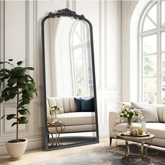 a living room with a large mirror and couches