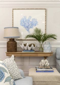 a living room with blue and white decor