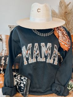 This sweatshirt goes out to all the mama's out there. Embroidered edge mama aztec patterned letters. Long Sleeve | Crew Neck | Unisex Fit Material: 50% Cotton | 50% Polyester Small (2/4) | Medium (6/8) | Large (10/12) | XL (14/16) | 2XL (18/20) Long Sleeve Sweatshirt With Lettering, Aztec Pattern, Letter Patterns, Going Out, Black And Grey, Crew Neck, Boutique, Grey, Sweatshirts