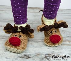 a pair of crocheted reindeer slippers with purple leggings