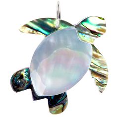 Make a splash in jewelry design with a brand new tradition! Perfect for earrings, necklaces, bracelets, and so much more, Layered Shell Sea Turtle Pendant offers plenty of charm! With layers of mother of pearl and paua shells shaped like a turtle, you'll have a uniquely handcrafted jewelry design that's completely you! Details: Length: 1 1/2" Width: 1 1/2" Metal Color: Silver Card contains 1 pendant. Artisan Jewelry With Lobster Clasp As Gift, Artisan Jewelry With Lobster Clasp For Gift, Nickel-free Symbolic Pendant Jewelry, Spiritual Turtle-shaped Jewelry Gift, Spiritual Turtle Shaped Jewelry Gift, Turtle Shaped Sterling Silver Jewelry Gift, Silver Turtle Jewelry For Gifts, Silver Turtle Jewelry Gift, Sterling Silver Turtle Jewelry Gift