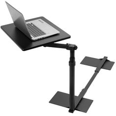 a laptop computer sitting on top of a black desk with two legs and a keyboard