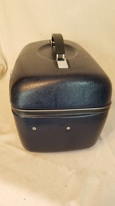 "Vintage Retro Boho Mid Century MCM Dark Navy Blue American Tourister Travel Cosmetic Makeup Carry On Hard Shell Train Case Luggage Suitcase. Measures 15\" long, 10\" deep, and 11\" high to top of handle. Missing one plastic peg in bottom section of case, but otherwise excellent vintage condition. If you like this listing, please visit our shop at http://theolivemoose.etsy.com All items are preloved. Our items are vintage and have typical wear from age. We do our best to carefully inspect and no Boho Mid Century, Luggage Suitcase, American Tourister, Train Case, Dark Navy Blue, Dark Navy, Makeup Cosmetics, Carry On, Retro Vintage