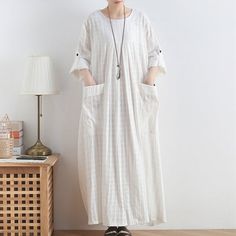 ★ Please provide a phone number when placing an order, thank you!★Material: linen  cotton*·.♥.·*´¨¨*·.♥.·*´¨¨*·.♥.·*´¨¨*·.♥.·*´¨¨*·.♥.·*´¨¨*·.♥.·*Size Measurements:Size(XL)bust is  145 cm/57”length is 125 cm/50''The model height is 160 cm, weight is 45KG♥Custom-made♥Please tell me your Weight, Height, Bust measurement. The basic measurements we need for making your order.Custom order need extra $15 and more one week. Long Shift Dress, Loose Long Dress, White Tunic Dress, Yellow Striped Dress, Summer Soft, White Cotton Dress, Cotton Linen Dresses, Big Pockets, Soft Dress