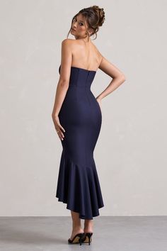 Prepare to impress at every event this summer in our latest midi Daylight. Arriving in a gorgeous navy premium stretch crepe with a figure enhancing corset bodice and fishtail silhouette, Daylight is the ultimate showstopper. Pair yours with our satin sling back heels Just A Fling to further elevate your look.Features - Premium stretch crepe- Fishtail silhouette - Bandeau neckline- Boned corset bodice- Sleeveless - Invisible zip closure- Midi length Sizing & Fit Model is 5'7 and wears UK size 8 / US size 4 Product Information Designed exclusively by Club L London Double layered with good stretch Premium stretch crepe in Navy (86% Polyamide, 14% Elastane)Lining (97% Polyester, 3% Elastane) 120cm front length SKU: CL134817020 Navy Corset, High Low Midi Dress, Sling Back Heels, Black Dress Prom, Black Tie Gala, Corset Bodice, Party Dress Long Sleeve, Christmas Party Dress, Bridesmaid Outfit