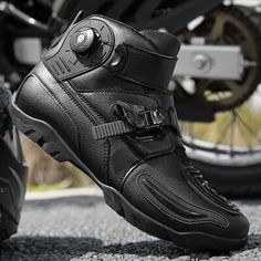 a pair of motorcyclist's shoes are shown on the ground next to a motorcycle