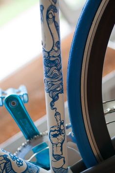 two blue and white bicycle tires sitting next to each other