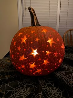 a carved pumpkin sitting on top of a table