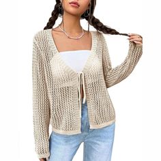 Introducing our Women's Lightweight Crochet Cardigan, the perfect combination of style, comfort, and versatility. This Tie Front Shrugs Knit Cardigan is designed to elevate your wardrobe with its chic and feminine look. The long sleeves and mesh design make it an ideal choice for layering over your outfits as a stylish cover-up during the summer months. Crafted from a blend of 89% Viscose and 11% Nylon, our women's cardigan is lightweight, soft, and breathable, providing a comfortable and flatte Casual V-neck Cardigan For Vacation, Beach V-neck Knitted Cardigan, Casual Crochet Cardigan For Fall, Non-stretch Open Front Cardigan For Vacation, Open Front Non-stretch Vacation Cardigan, Knit V-neck Cardigan For Vacation, Knitted Cardigan For Fall Vacation, Fall Vacation Knitted Cardigan, Casual Long Sleeve Cardigan For Vacation