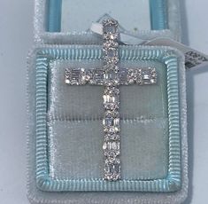 Beautiful Diamond Cross Pendant.  Unique design baguette and round diamond cross.  Excellent craftsmanship, all very sparkling diamonds.  The chain slides through the back for a clean look.  Lays nicely on the neck, won't flip around.   The diamonds really catches the light beautifully.  This beautiful cross is one you will cherish for life.  Cross is a nice size measures about 40 x 23mm.  Clean Diamonds even when you look under a magnifying glass.  White gold sold out.   Genuine Diamonds Round Brilliant and Baguette Cut Diamonds  Total Weight: 1.10 Carats  Clarity: VS/SI Color: F  Clean clean Diamonds, absolutely no black carbon spots.   Solid 18K White Gold 3.56 grams Comes with gift box.   *please let us know if you need a gold chain for purchase  * We have been in the wholesale Jewelry Flower Diamond Ring, Diamond Cross Necklace, Beautiful Cross, Diamond Cross Pendants, Diamond Cross, Sell Gold, Cross Jewelry, Magnifying Glass, Baguette Diamond