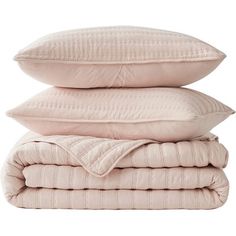 three pillows stacked on top of each other