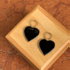 Estate/ Vintage 14KT yellow gold heart-shaped black onyx, bezel-set hooplet earring charms. 1 Pair Large Hearts Not stamped, but tests 14KT Very good estate condition Gold heart measures: 12mm Entire hooplet charm measures 23mm x 15.5 Fits up to 5.5 wide hoops Weighs 3.40 grams for the pair Hoop earrings not included Black Earrings For Anniversary On Valentine's Day, Black Earrings For Valentine's Day Anniversary, Black Double Heart Jewelry For Anniversary, Black Round Jewelry For Valentine's Day, Black Heart Charm Jewelry With Heart Cut, Black Heart-shaped Pierced-style Jewelry, Black Dangle Heart Pierced Earrings, Tarnish Resistant Black Dangle Jewelry, Black Tarnish Resistant Dangle Jewelry