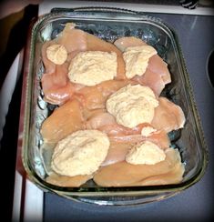 a glass dish filled with food on top of a stove