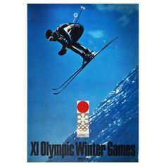 an olympic winter games poster with a skier in the air