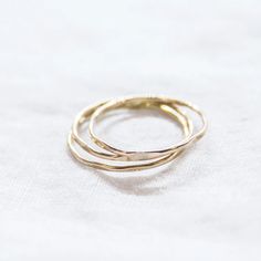 HAMMERED STACKING RING – NVMBR DCMBR Everyday Hypoallergenic 14k Gold Stackable Rings, Simple Hammered Ring Jewelry, Yellow Gold Brass Stackable Rings, Yellow Gold Brass Stackable Promise Rings, Stackable 14k Gold Filled Round Band Rings, Stackable 14k Gold Filled Rings With Round Band, Minimalist Hammered Stackable Rings, Handmade Dainty Stackable Promise Rings, Everyday Hammered Sterling Silver Stackable Rings