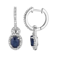 Beautifully adorned with oval-cut sapphires and scintillating diamonds, these 10k white gold drop earrings elegantly enhance your favorite evening attire.EARRING DETAILSLength: 21.00 mmBackings: hingeMetal: 10k white goldFinish: polishedPackaging: boxedSTONE DETAILSStone type: sapphire Total weight: 1 ct.Center stone size: 6 mm x 4 mmShape: ovalSetting: prongDIAMOND DETAILSTotal weight: 1/4 ct.Color grade: I-JClarity: I2-I3Shape: roundSetting: prongGemstones may have been treated to enhance thei Classic Oval Sapphire Diamond Earrings, Oval Sapphire Earrings With Diamond Accents, Sapphire Oval Diamond Earrings, Sapphire Color Oval Diamond Earrings, Oval Sapphire Diamond Earrings For Anniversary, Oval White Gold Diamond Earrings Fine Jewelry, Oval White Gold Diamond Earrings, Oval Sterling Silver Diamond Earrings, Oval White Gold Diamond Earrings In Sterling Silver