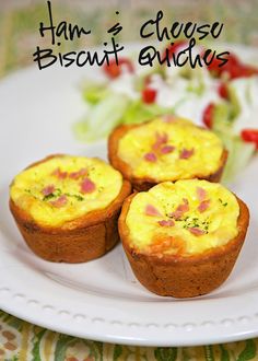 three small muffins on a white plate with lettuce