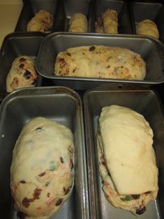 four pans filled with different types of bread