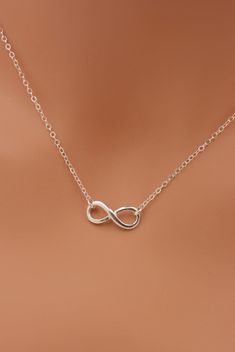 MADE WITH ALL SOLID STERLING SILVER PARTS - A GREAT KEEPSAKE This beautiful piece is made using solid sterling silver for a quality necklace. I use a sterling silver infinity charm set on a sterling silver chain. The necklace closes with a spring clasp. The infinity charm is the perfect size for a refined look. Comes in a gift box, perfect for gift-giving. **SIZING - PLEASE READ: Select your necklace size at checkout. Note that necklaces will fit differently depending on a person's size. Please Silver Infinity Necklace, Infinity Necklace Silver, Infinity Charm, Relationship Gifts, Mini Charm, Infinity Necklace, Friend Necklaces, Summer Necklace, The Infinity