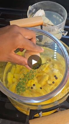 a person is mixing food in a bowl on the stove