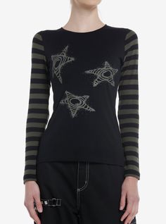 Go for the grunge look with this long-sleeve! Featuring black and olive stripes on the sleeves and spiral stars printed on the chest.60% cotton; 40% polyesterWash cold; dry lowLength: 25''ImportedListed in junior sizesModel height: 5' 10''Model wears size Small Neck Aesthetic, Aesthetic Stars, Y2k Star, Gothic Tops, 2 Piece Skirt Set, Cozy Tops, Black Olive, Tops Fall, Girls Long Sleeve