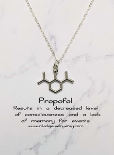 a necklace with the chemical symbol propofil on it