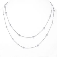 Delicate Design, this must-have Diamond Station Necklace adds a Feminine Accent to any style. Solid White , Yellow or Rose Gold Necklace with a Segment of 20 bezel Diamond Around the Neck line, uber chic and dainty, wear it by itself or layered AND Pair it with your casual or formal attire. Number of Stones: 20 Length of Chain: 32 inches Diamond Cut: Ideal cut Color: White Clarity: VS2-SI1 Clasp: Lobster-Clasp Setting: Bezel Set Enjoy 30 days money back guarantee. Diamond By The Yard, Delicate Design, Station Necklace, Bezel Diamond, Formal Attire, Rose Gold Necklace, Cut And Color, Diamond Cut, Bezel Setting