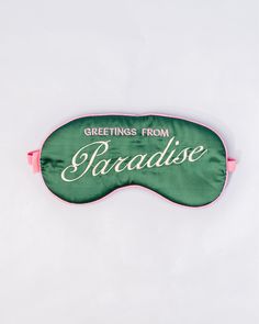 dark green sleep mask with pink and white embroidered 'greeting from paradise' with pink adjustable strap Tech Books, Calendar Notebook, Desk Planners, Writing Supplies, Take A Nap, Sleep Mask, Hat Hairstyles, Travel Accessories, Travel Bags