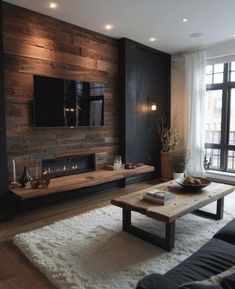 the living room is decorated in black and wood